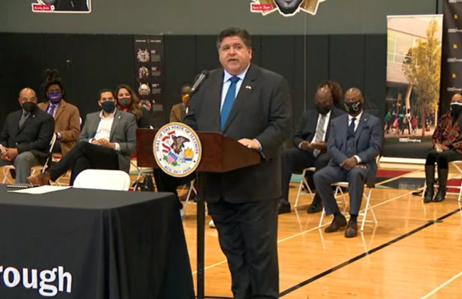 Governor Pritzker speaking at an even
